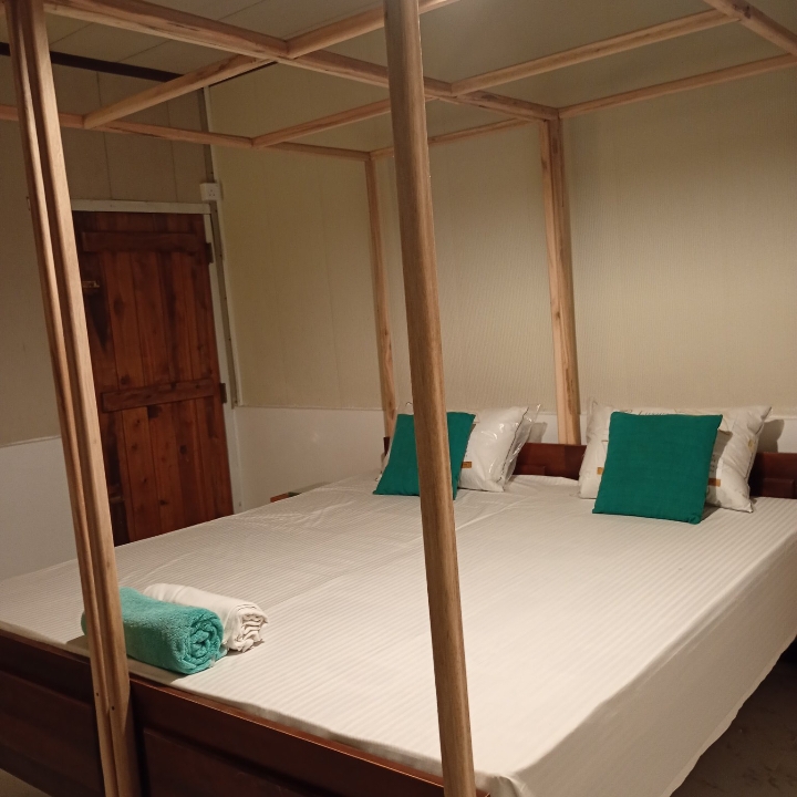 Four-poster bed inside an air-conditioned cabana